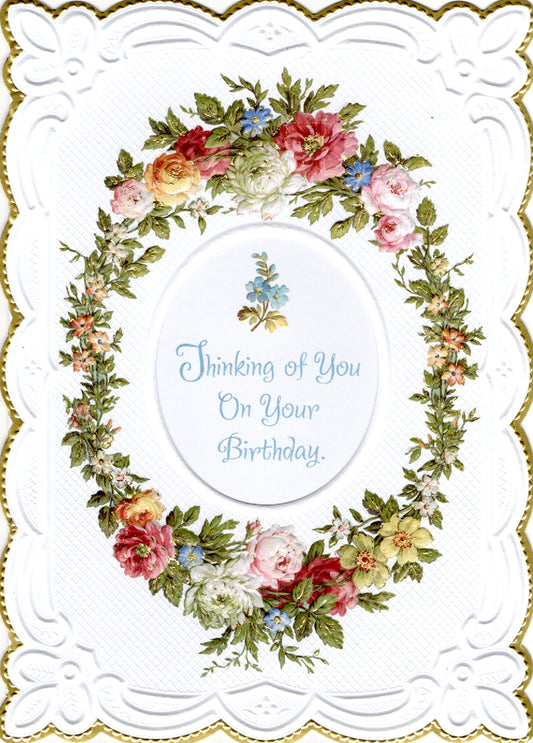 Floral wreath Thinking of you on your birthday embossed die cut general birthday greeting card by Carol Wilson. Inside:...and wishing you the happiest kind of day! Retail $4.25.  | CRG1555 | 255650